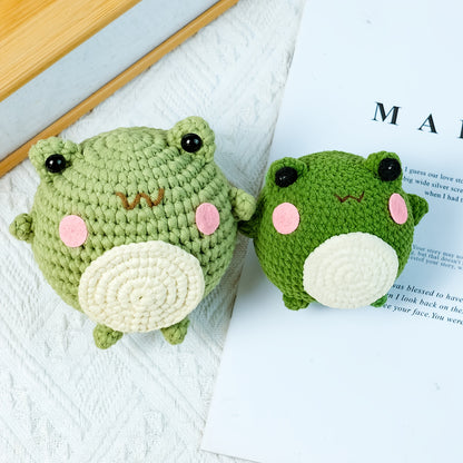 The New Crochet Material Pack Includes An English Instruction Manual, An Adult Beginner's Crochet Yarn Kit, A DIY Beginner's Frog Knitting Craft, And A Frog Doll Crochet Material Pack with A DIY School Bag Keychain And Mobile Phone Charm.